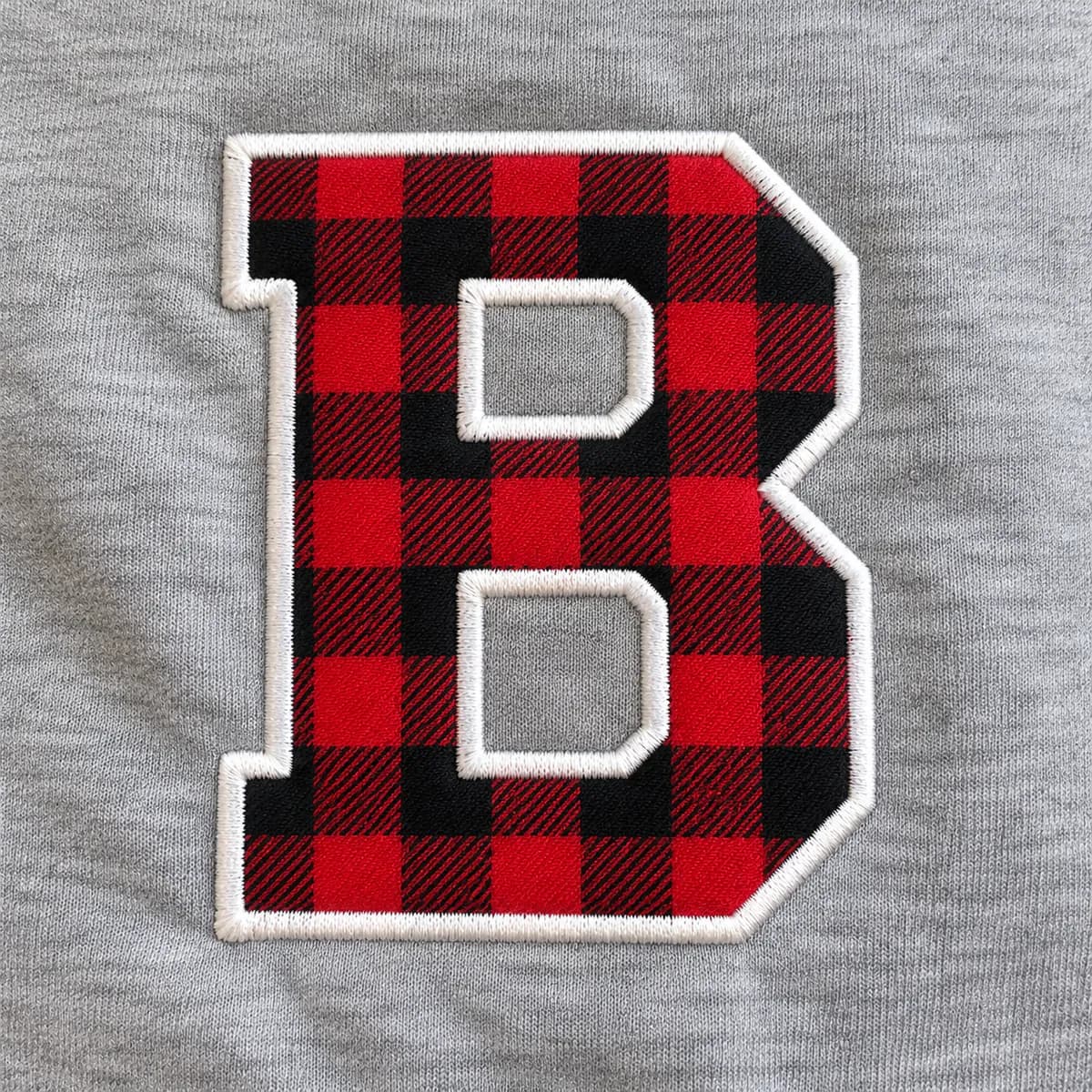 Finished applique embroidery with satin-stitched edges