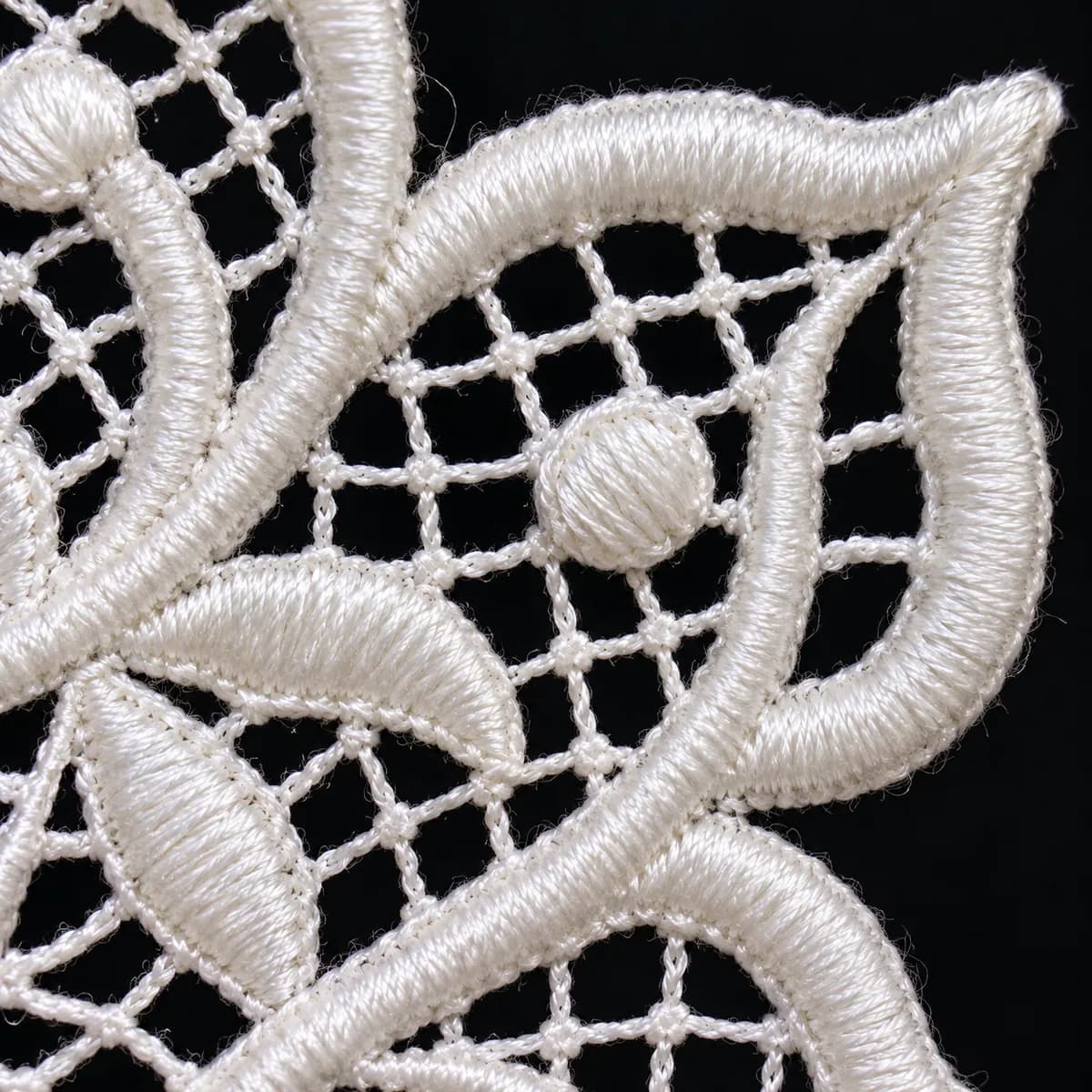 Close-up of a free standing lace lattice and satin border