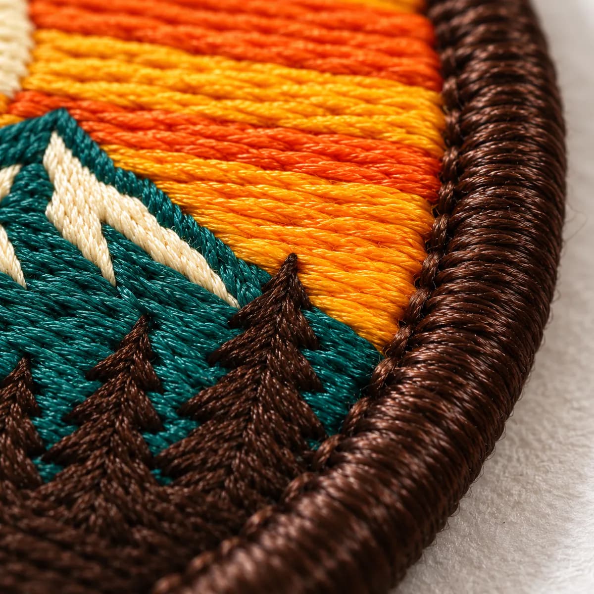 Close-up of embroidered patch fill and border stitches